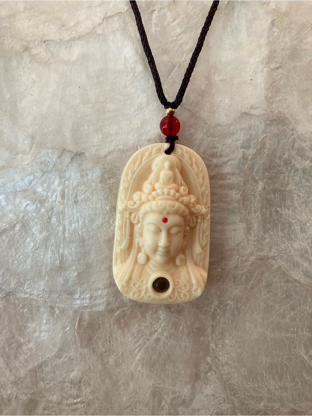 Ivory-Tone carved Buddha Pendant Necklace with Red Accent Bead on black cord